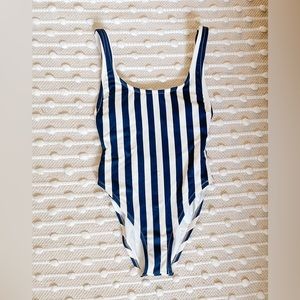 Navy and white striped swimsuit. Gently used condition. No visible flaws.